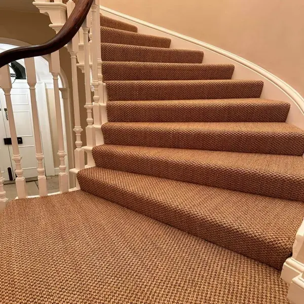 Textured brown stair carpet with woven pattern