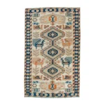 Ivory rug with blue medallions, bird motifs
