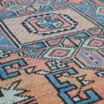 rug with a central star medallion and geometric diagonal border.
