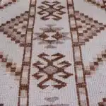 turkish carpet with brown diamond and zigzag patterns